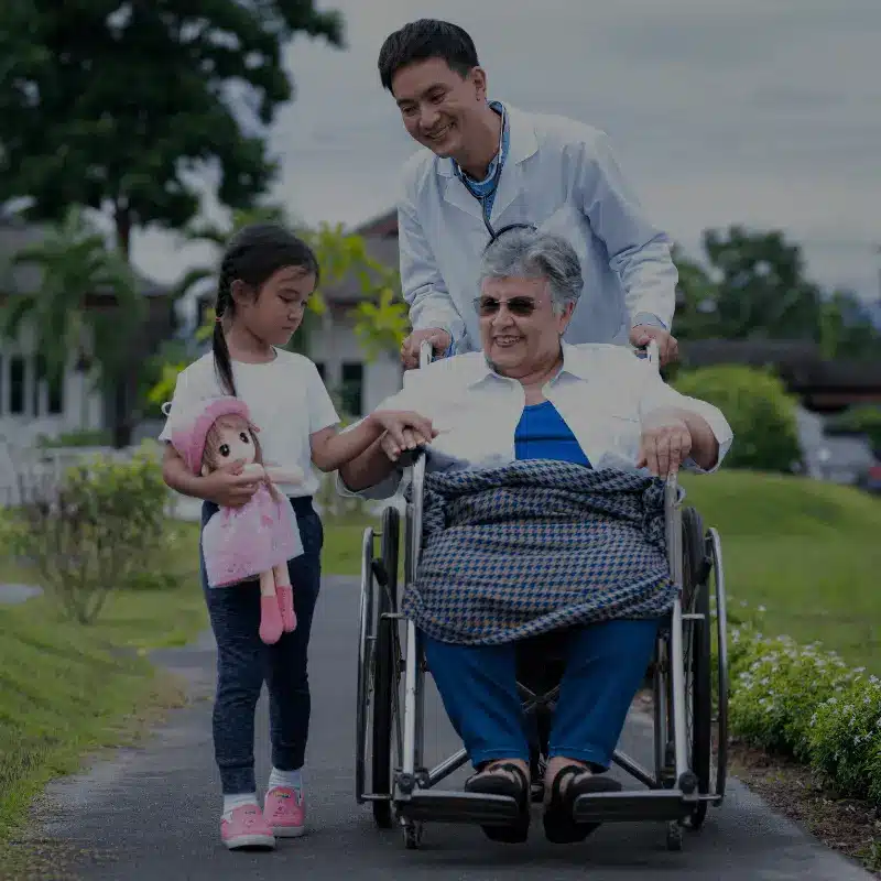 A woman in a wheelchair gets pushed.